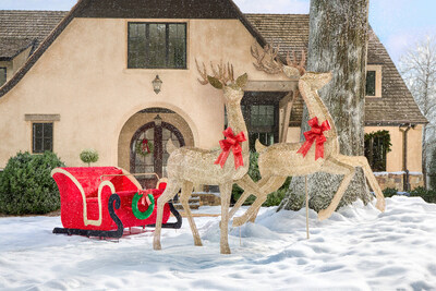 Lowe’s 43.5-in Holiday Living sleigh yard decoration and prancing and standing reindeer create the perfect festive in-store photo backdrop for families.