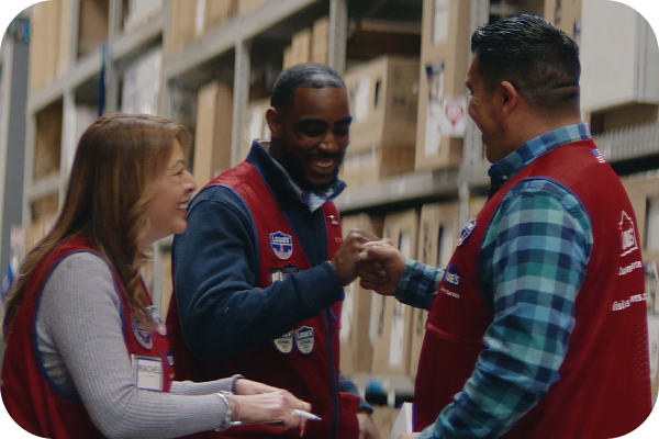 Store associates laughing and celebrating together