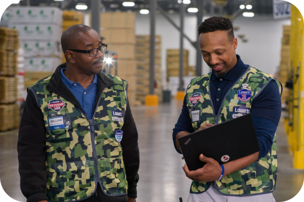 Supply Chain team members wearing their Lowe's military vests